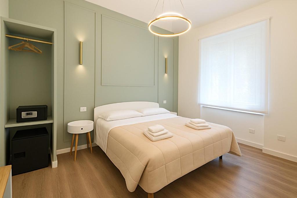 Postel nebo postele na pokoji v ubytování B&B Aurelia Garden Rooms