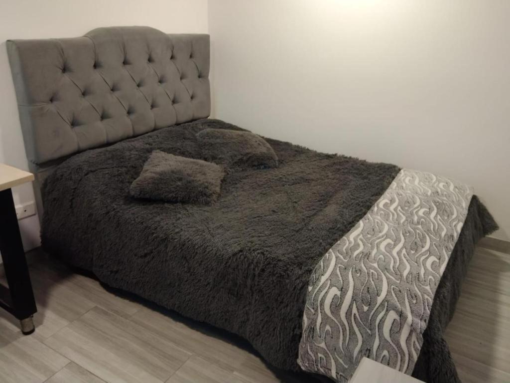Postel nebo postele na pokoji v ubytování Hospedaje la Magia de Zipaquirá