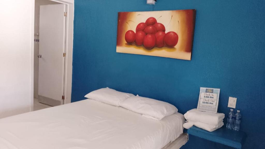 Postel nebo postele na pokoji v ubytování Hotel Costa Esmeralda