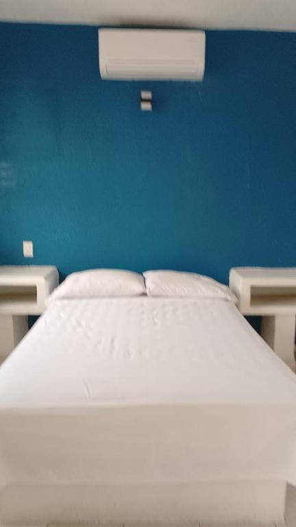 Postel nebo postele na pokoji v ubytování Hotel Costa Esmeralda