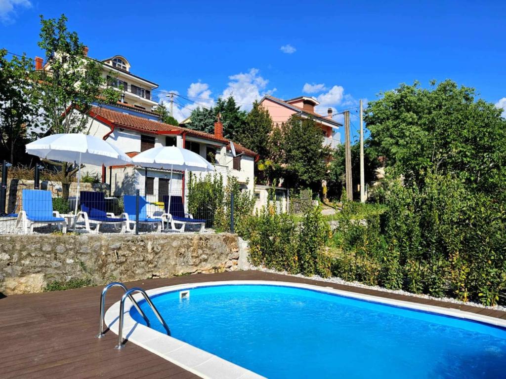 Πισίνα στο ή κοντά στο Domagoj - luxury apartments with heated swimming pool, jacuzzi and seaview