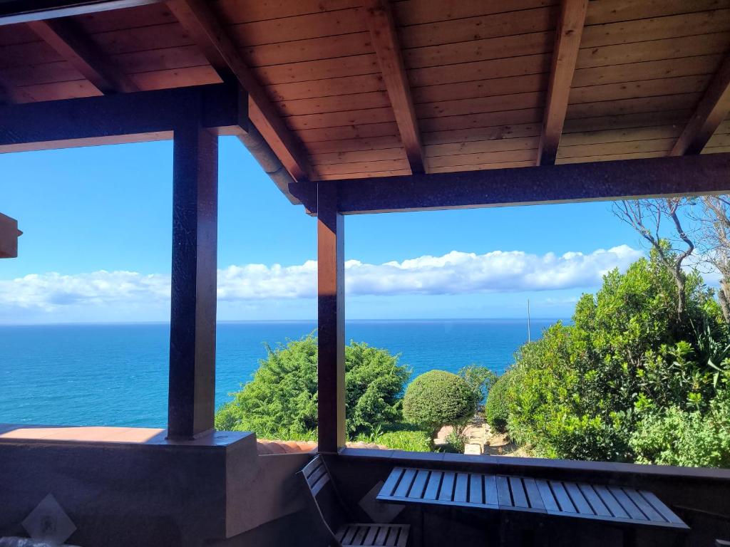 a view of the ocean from a house at Casa Tiemme Vista Mare in Costa Paradiso