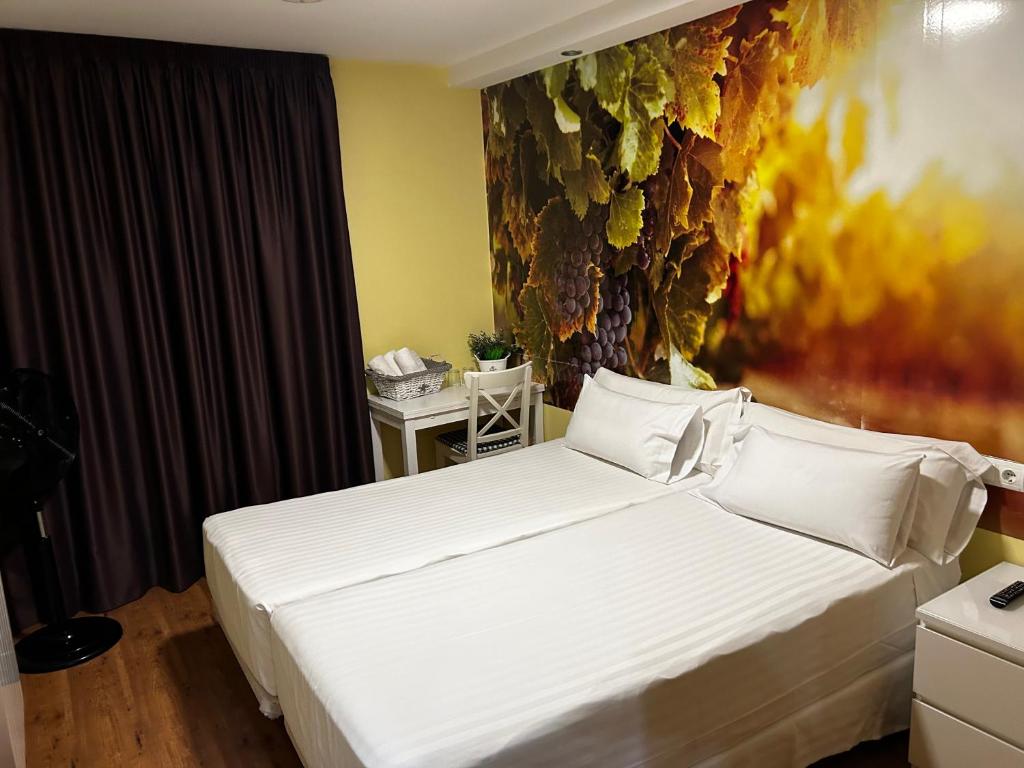 Postel nebo postele na pokoji v ubytování The Way Hotel Molinaseca
