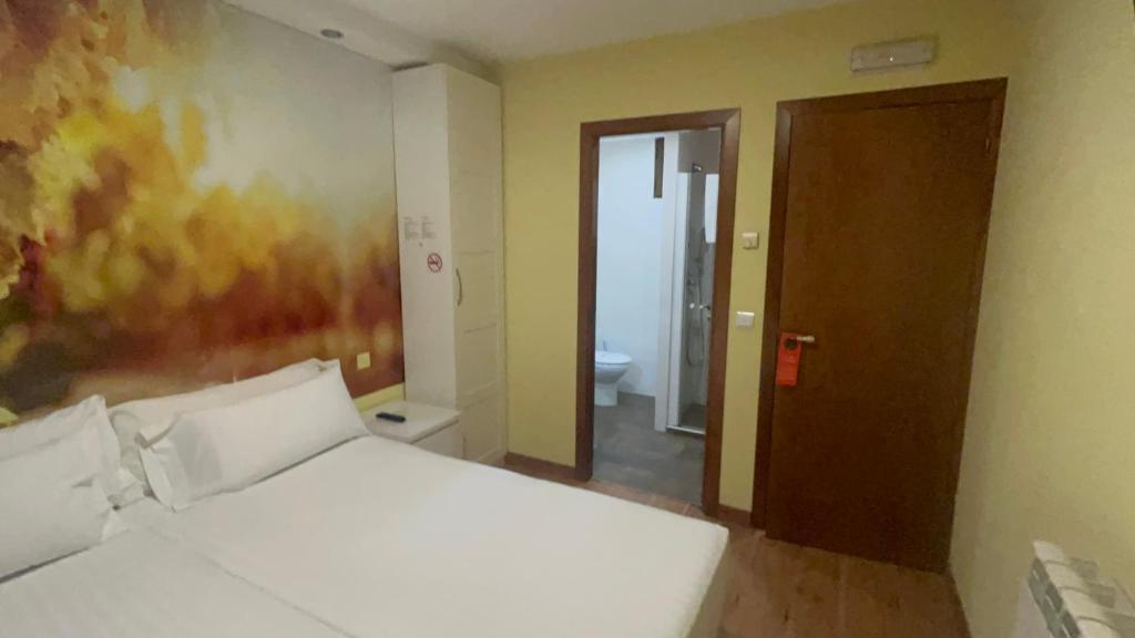 Postel nebo postele na pokoji v ubytování The Way Hotel Molinaseca