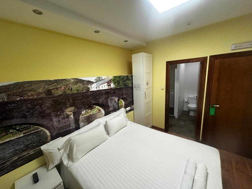 Postel nebo postele na pokoji v ubytování The Way Hotel Molinaseca