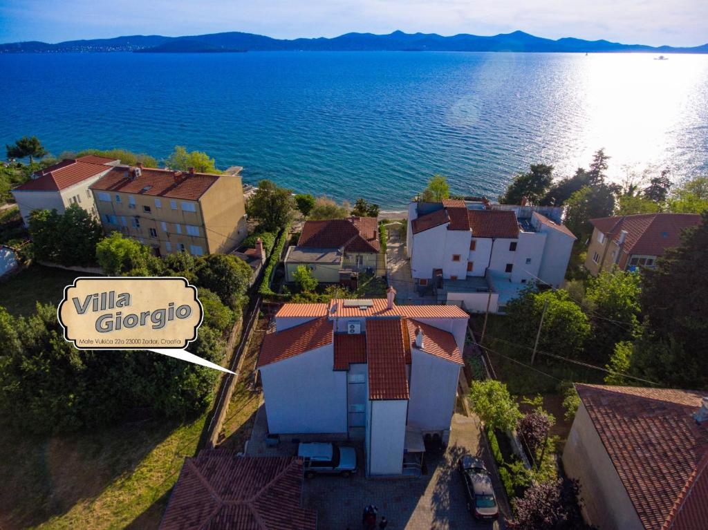 an overhead view of a town with a sign and the water at Giorgio - Fontana in Zadar