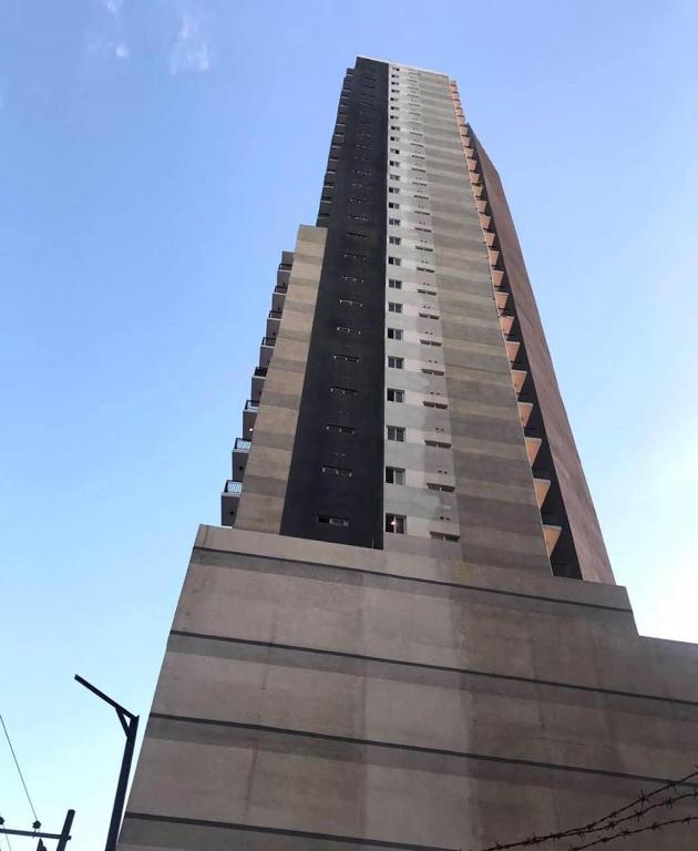 a tall building with a blue sky in the background at Cityscape Grand Tower Condo, studio unit in Cebu City