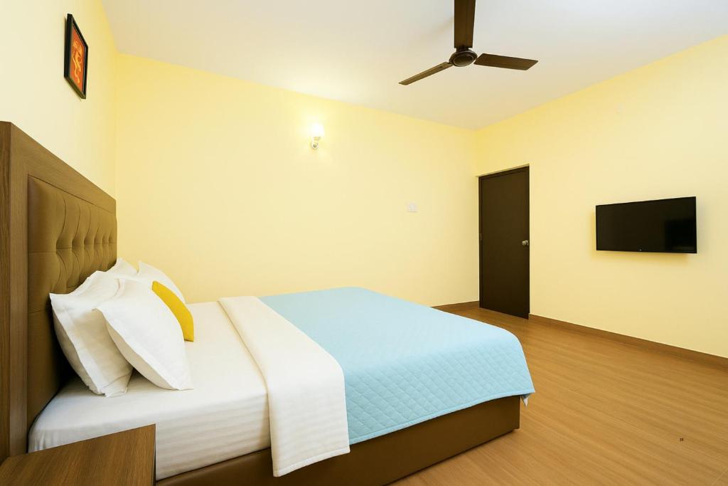 Postel nebo postele na pokoji v ubytování Hotel Calangute Beach Imperial