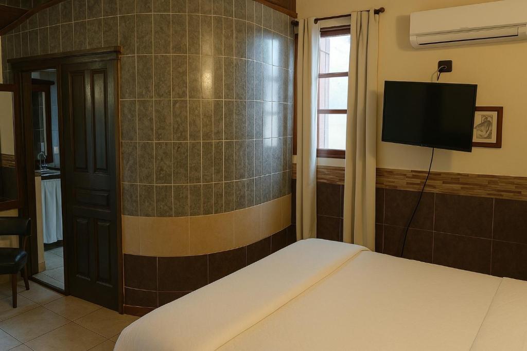 TV a/nebo společenská místnost v ubytování La Locanda