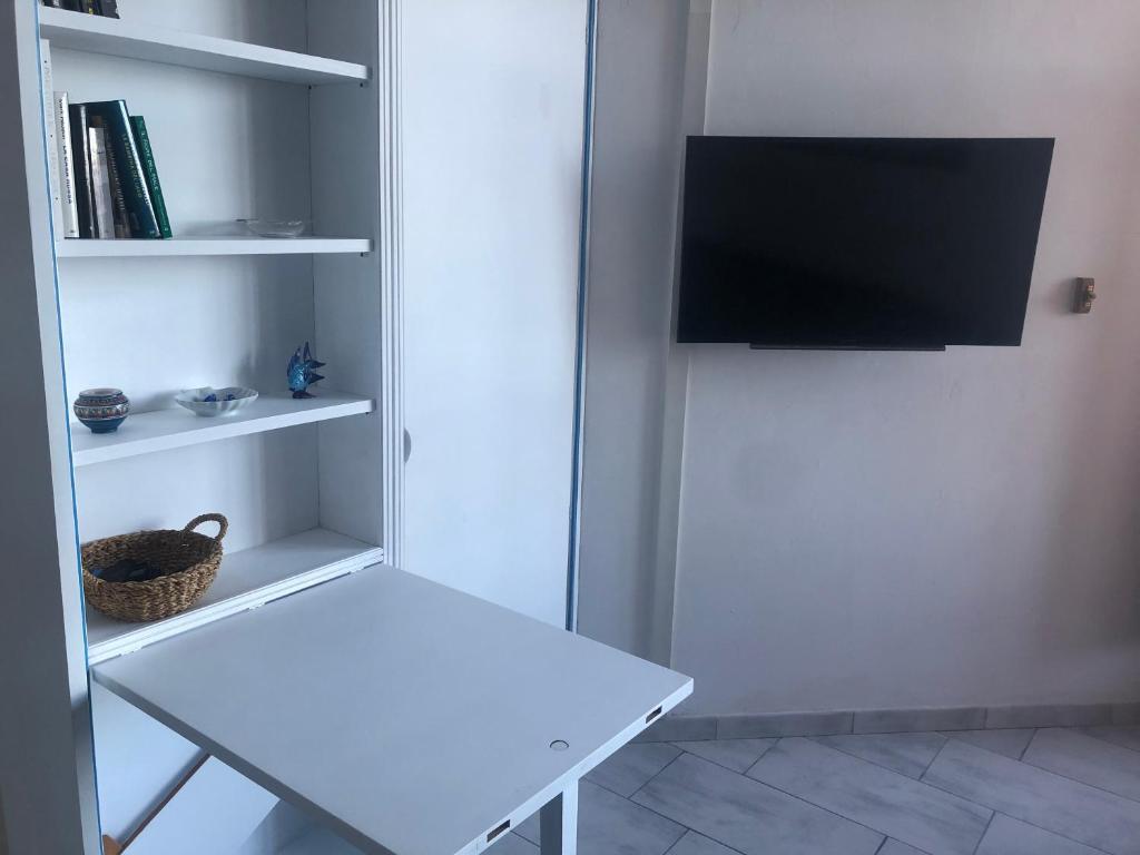 TV a/nebo společenská místnost v ubytování orizzonte mare