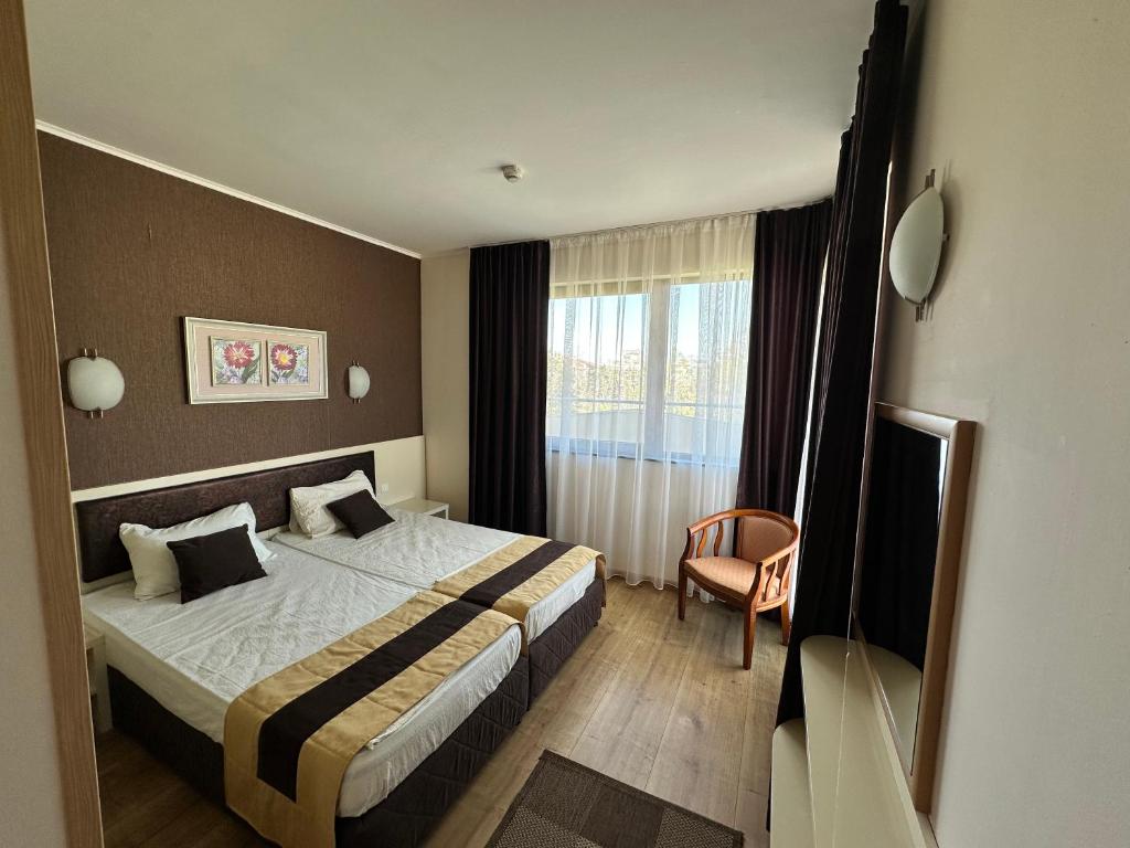 Postel nebo postele na pokoji v ubytování Hotel Capri