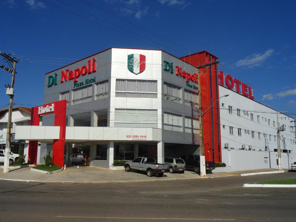 a large building with a truck parked in front of it at Di Napoli Plaza Hotel in Gurupi