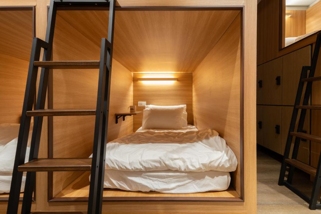 Postel nebo postele na pokoji v ubytování Boro Hanok Hostel in Myeongdong