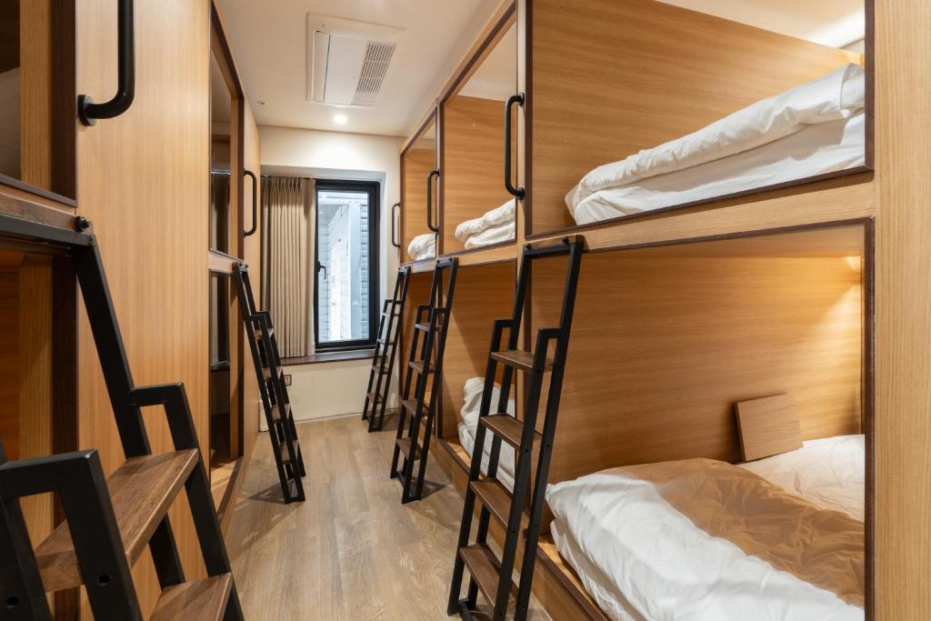 Ein Bett oder Betten in einem Zimmer der Unterkunft Boro Hanok Hostel in Myeongdong