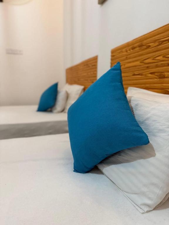 Postel nebo postele na pokoji v ubytování Thambara Resort
