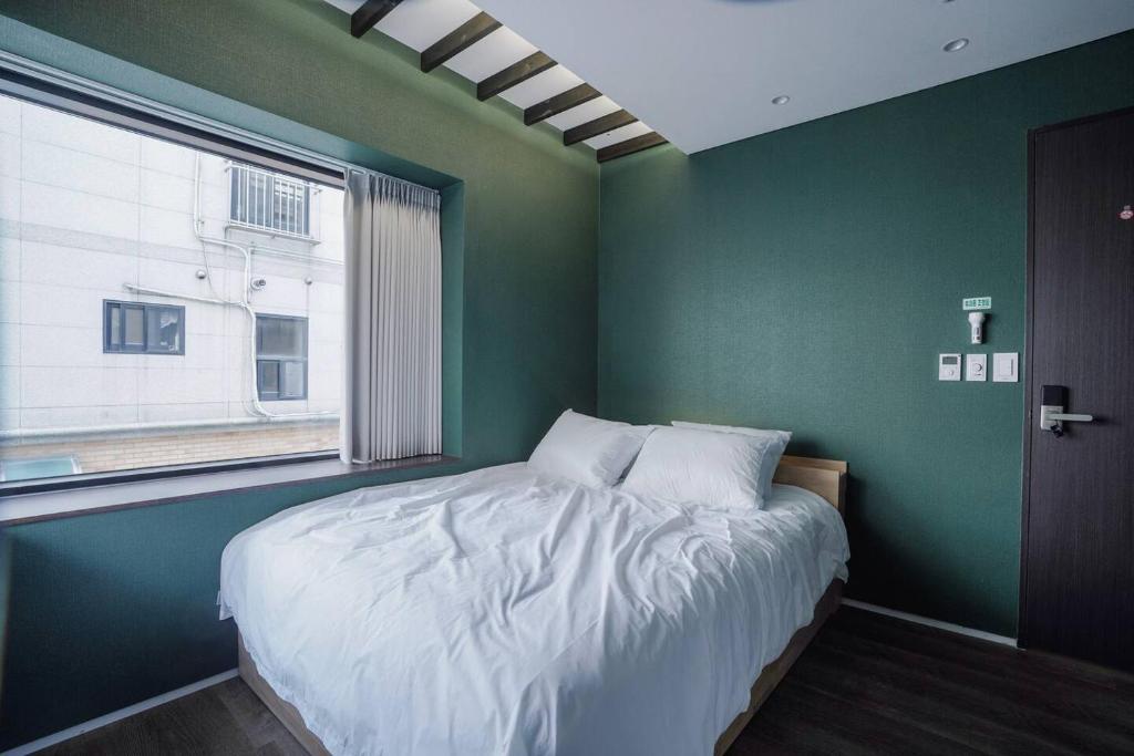 Postel nebo postele na pokoji v ubytování Boro Hanok Hostel in Myeongdong