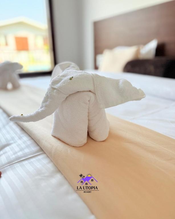 Postel nebo postele na pokoji v ubytování La Utopia Resort