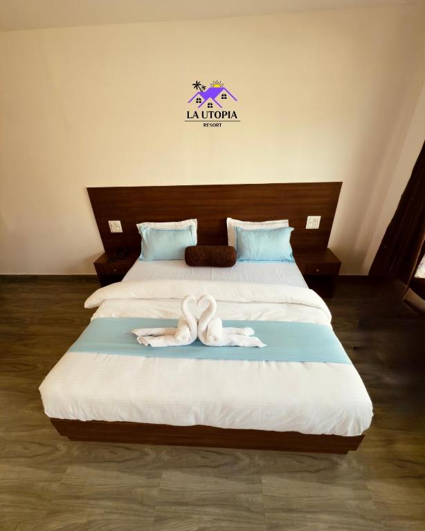 Postel nebo postele na pokoji v ubytování La Utopia Resort