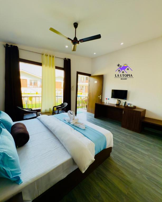 Postel nebo postele na pokoji v ubytování La Utopia Resort