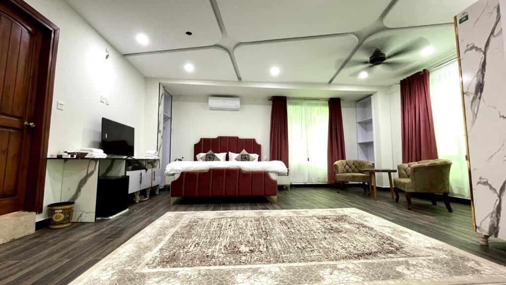 Postel nebo postele na pokoji v ubytování Harriot Hotel Skardu