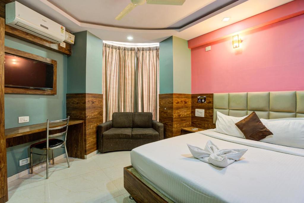 Ένα ή περισσότερα κρεβάτια σε δωμάτιο στο Hotel Diamond Palace, Madiwala