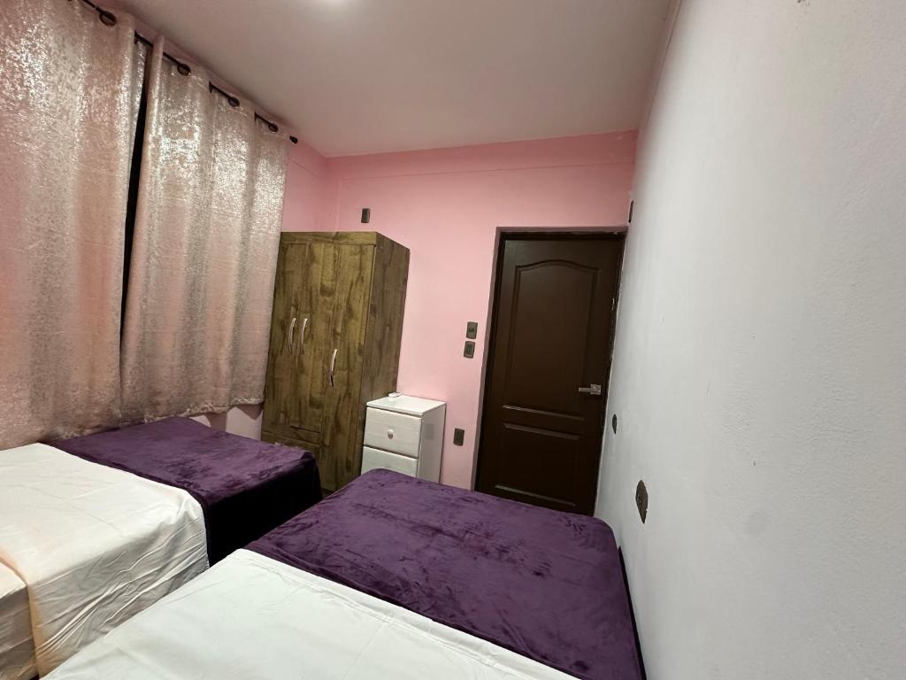 Postel nebo postele na pokoji v ubytování Santana Lux