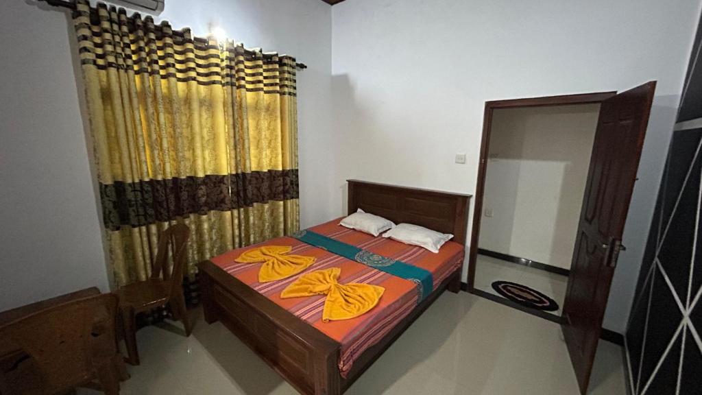 Postel nebo postele na pokoji v ubytování Mango House River Inn Negombo