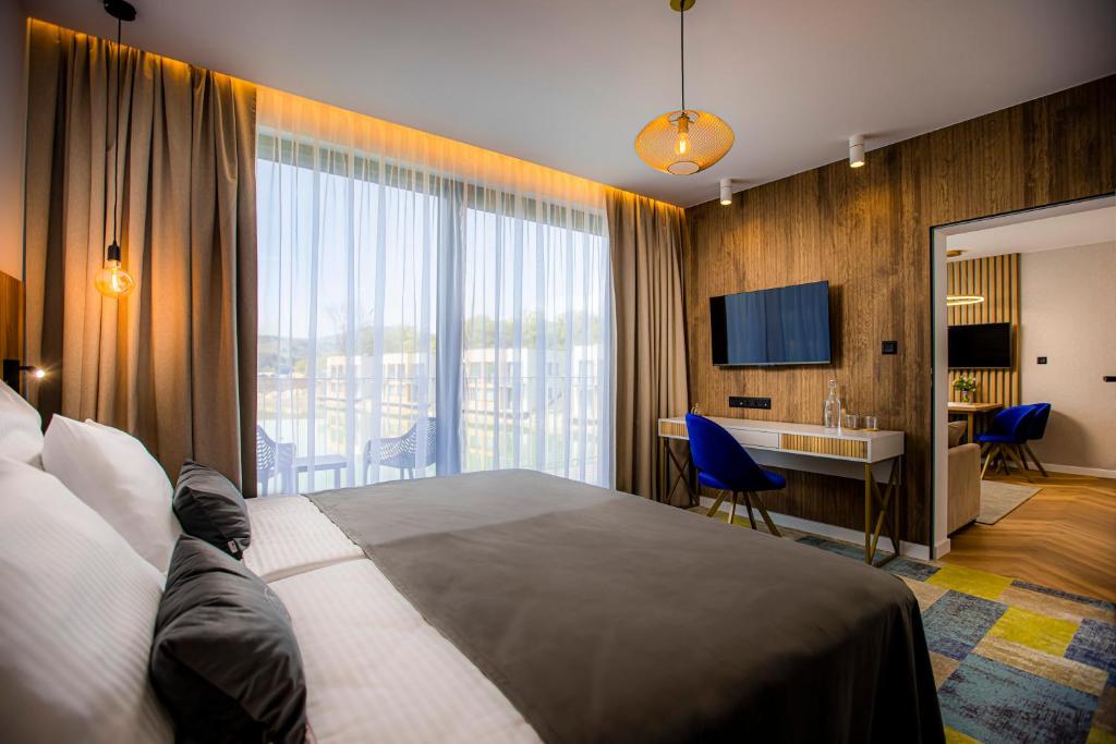 Postel nebo postele na pokoji v ubytování TILIA Resort