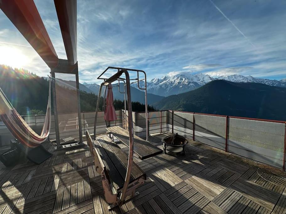 a balcony with a swing and a view of mountains at Mont Blanc view on a 40m2 Terrace in Passy