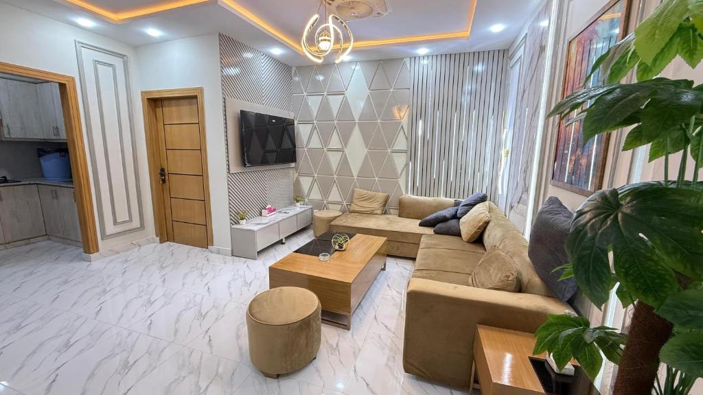 a living room with a couch and a coffee table at ParkView City Lake Facing in Malot