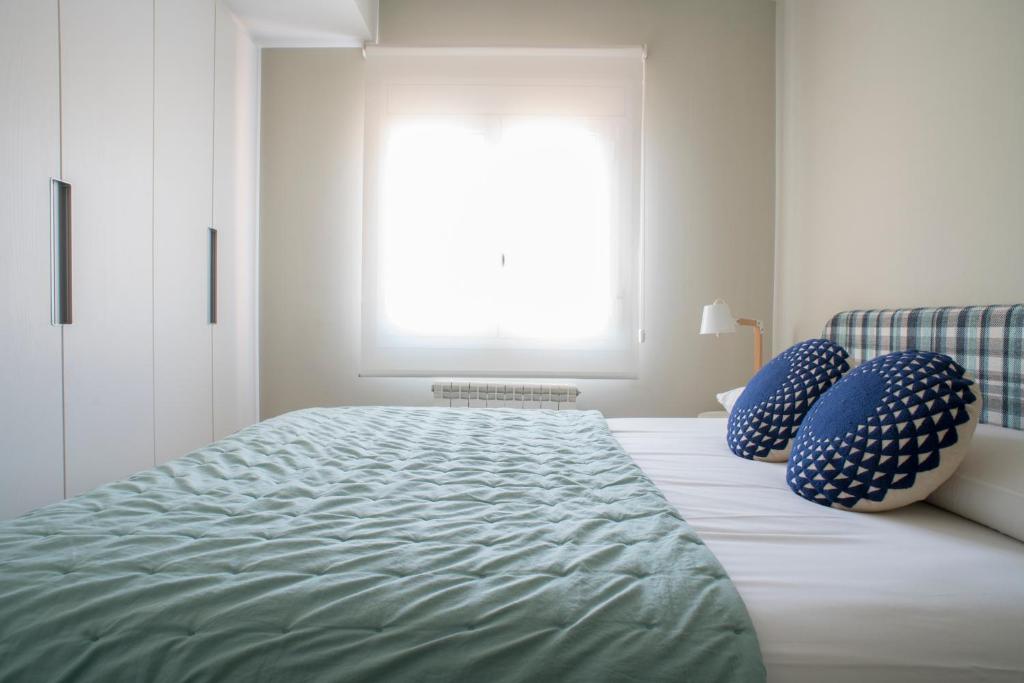 Cama o camas de una habitación en Apartaments Turístics Cardona II