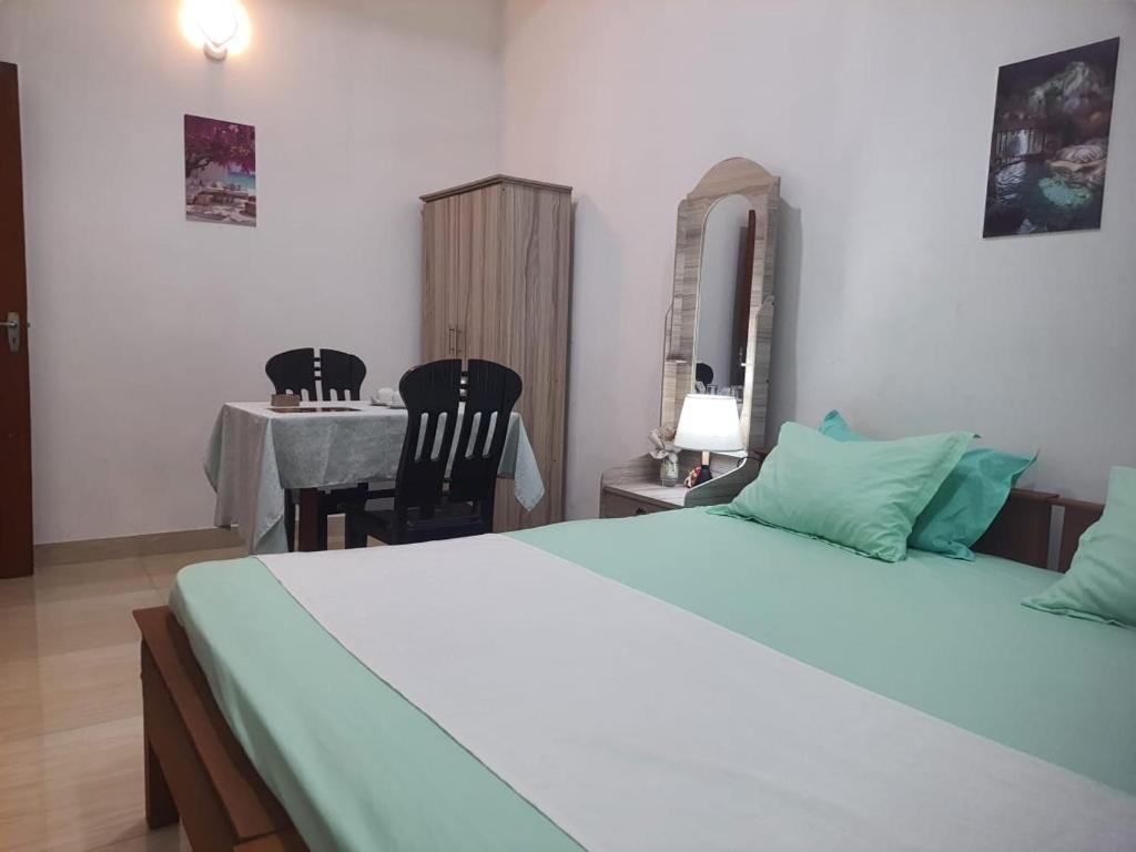 Postel nebo postele na pokoji v ubytování CANAAN MUSIC Hotel