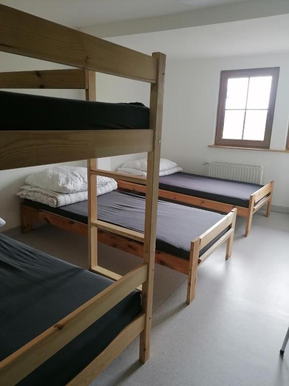 Postel nebo postele na pokoji v ubytování Schronisko PTTK Pod Muflonem