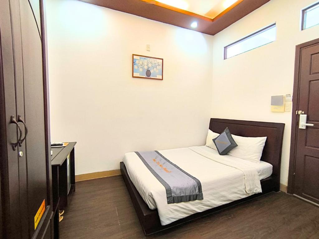 a bedroom with a bed in a room at Sontra Sea Hotel in Danang