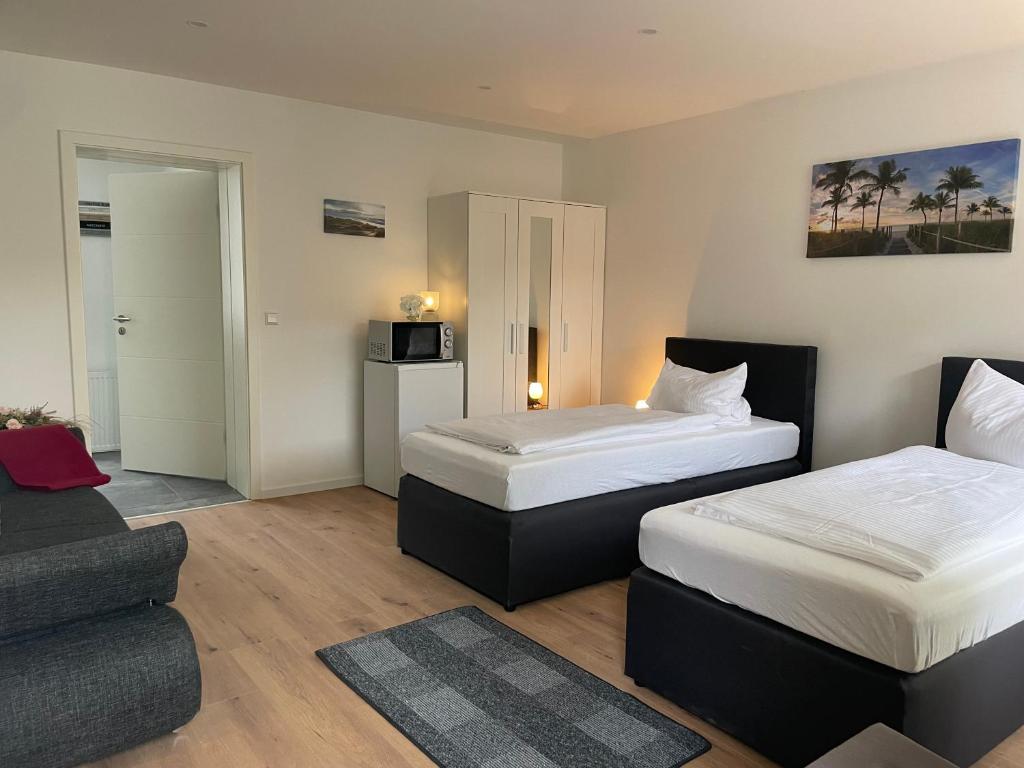 Postel nebo postele na pokoji v ubytování Motel Königslutter