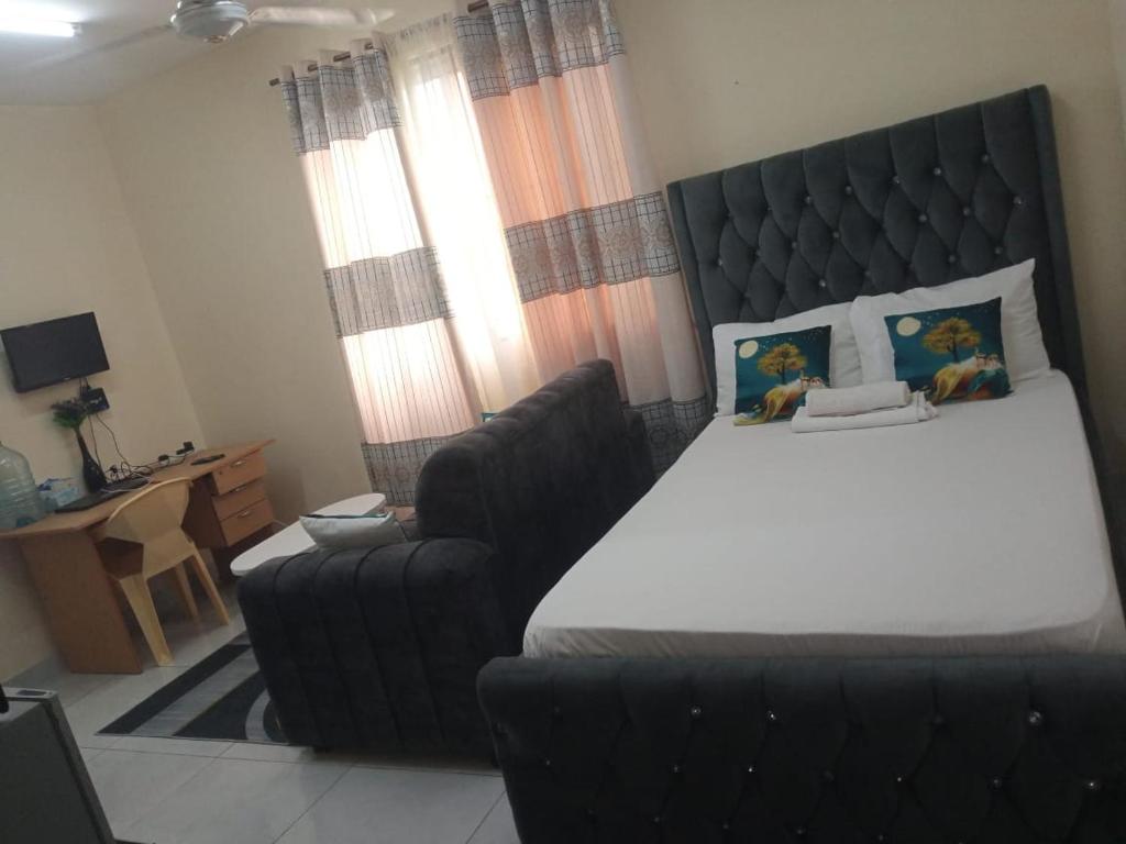 Una cama o camas en una habitación de Utange studio