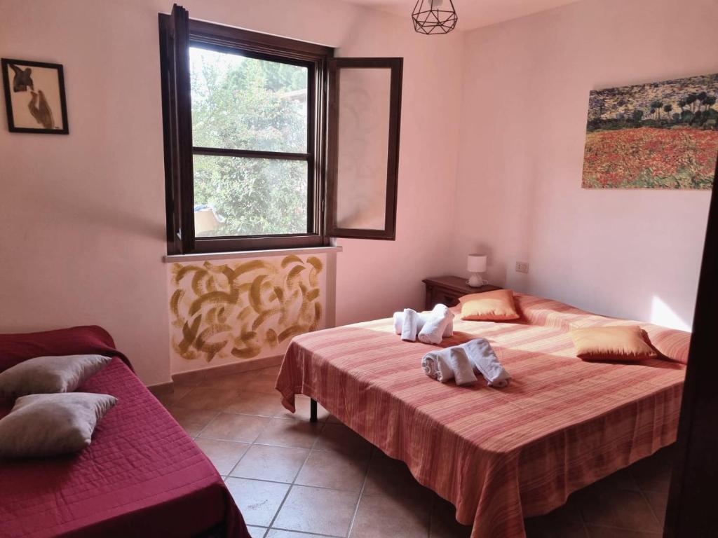 Postel nebo postele na pokoji v ubytování Agriturismo TERRANERA