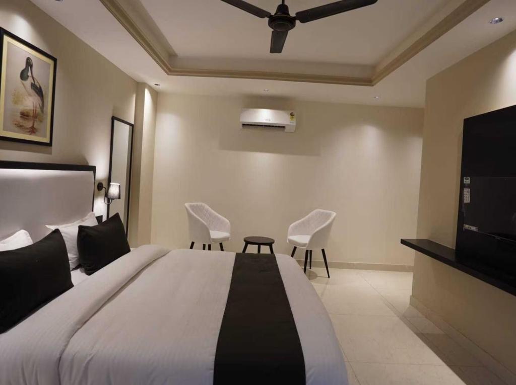 Postel nebo postele na pokoji v ubytování Hotel Grand Marina
