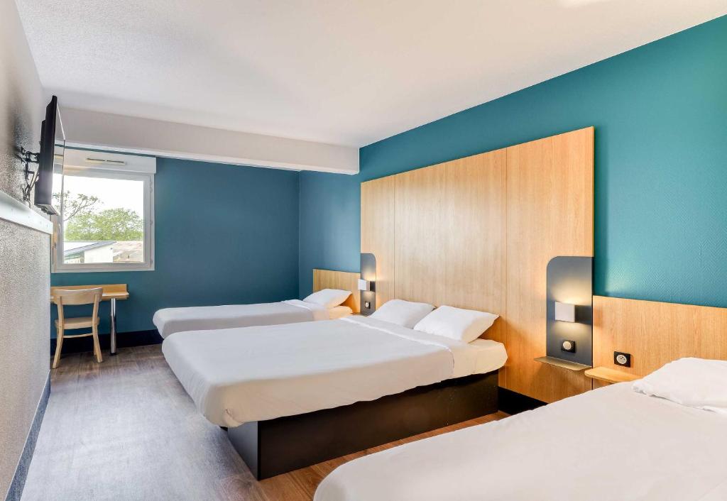 Postel nebo postele na pokoji v ubytování B&B HOTEL Pézenas