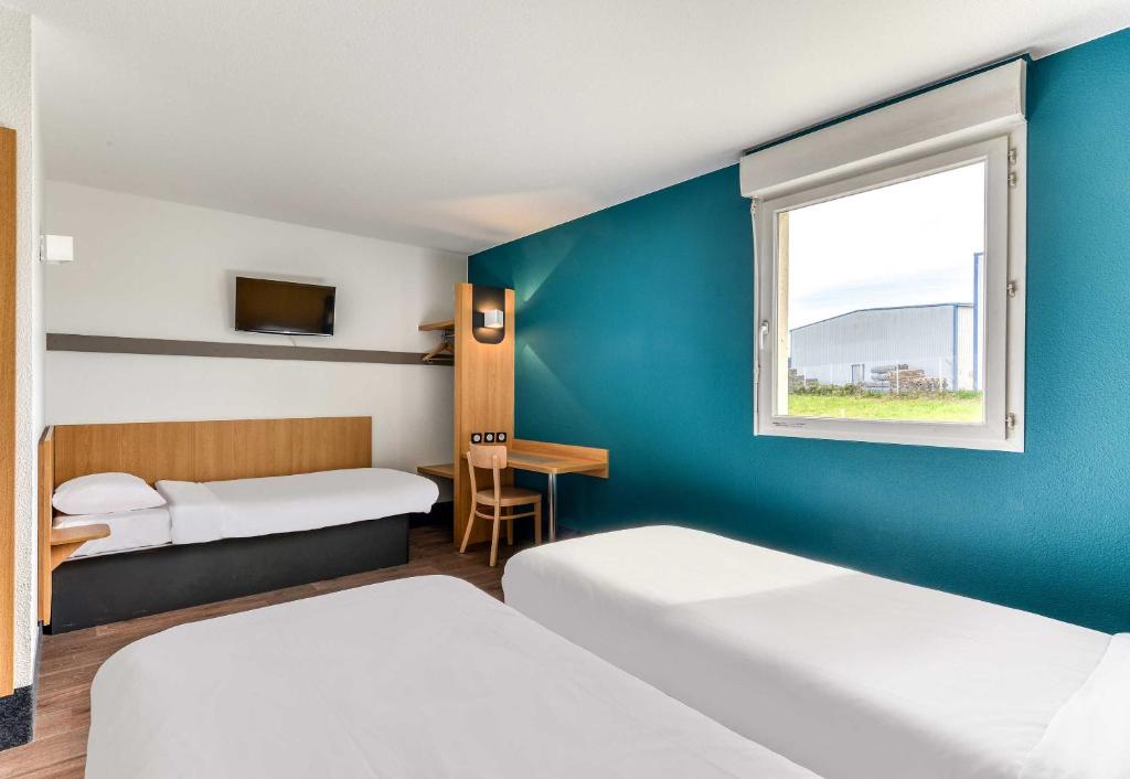 Postel nebo postele na pokoji v ubytování B&B HOTEL Pézenas