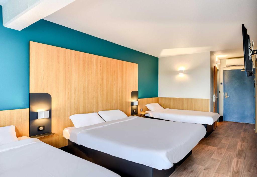 Postel nebo postele na pokoji v ubytování B&B HOTEL Pézenas