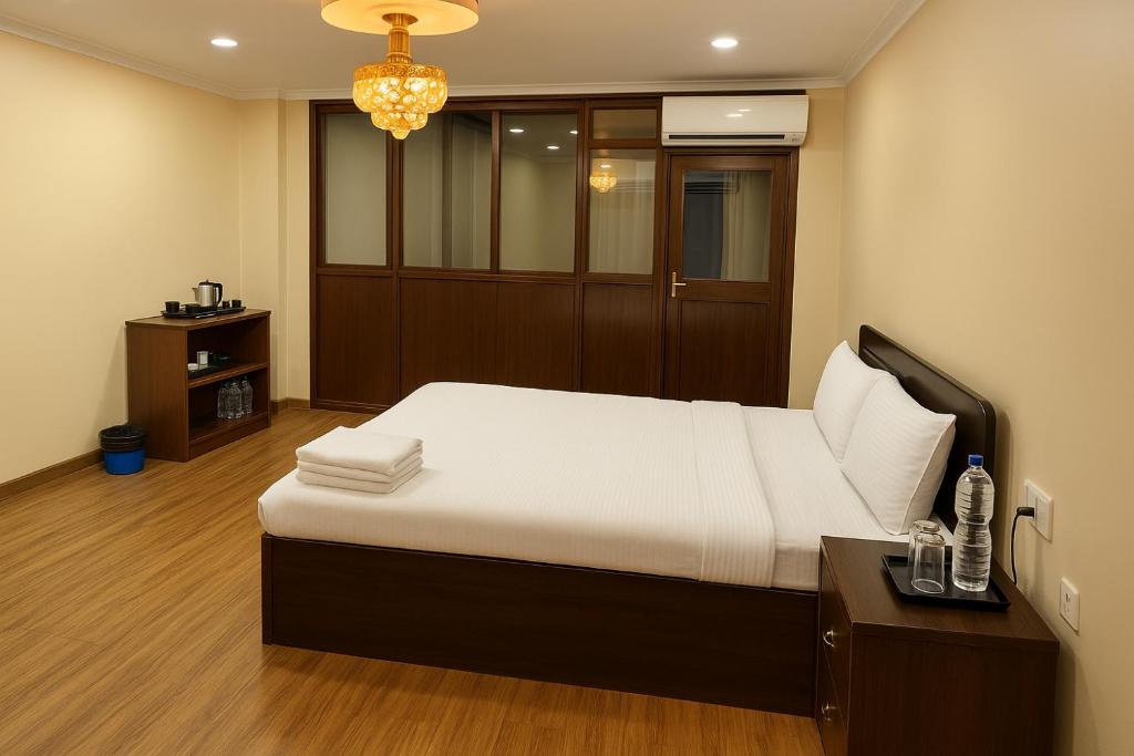 Postel nebo postele na pokoji v ubytování Boudha Mandala Hotel
