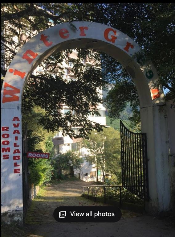 an archway with an entrance to a gate at Winter Green Resorts, Munnar in Munnar