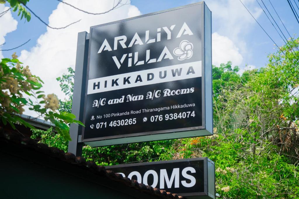 a sign for a kalamaja villas restaurant at Araliya Villa Hikkaduwa in Hikkaduwa