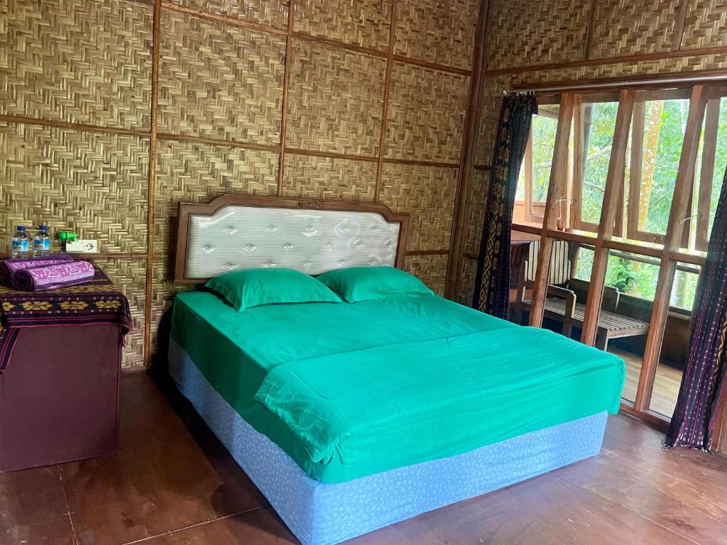 Postel nebo postele na pokoji v ubytování Joben Ecolodge