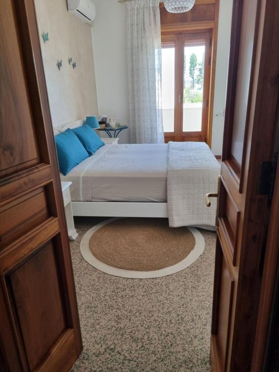 Кровать или кровати в номере La Dimora del Giglio B&B