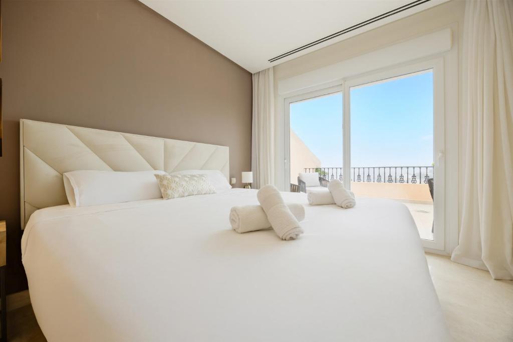 Postel nebo postele na pokoji v ubytování Penthouse with sea views in Nueva Andalucia