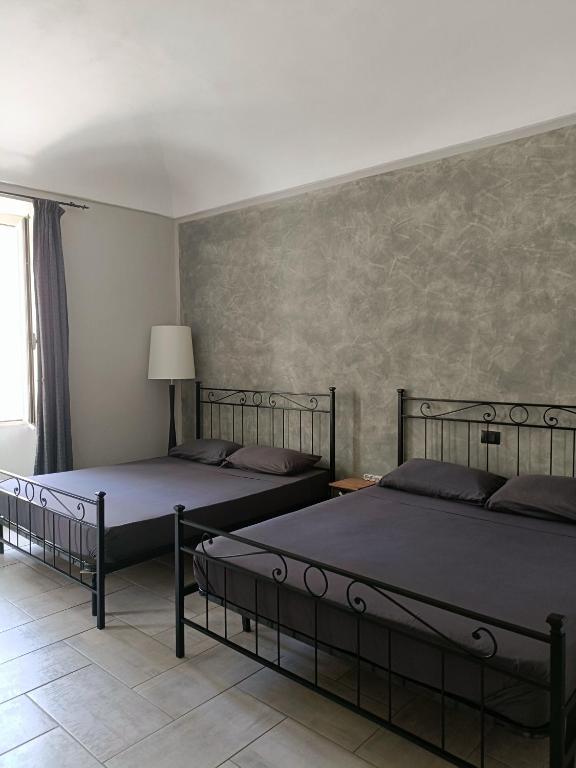 Postel nebo postele na pokoji v ubytování B&B L'Antico Portico