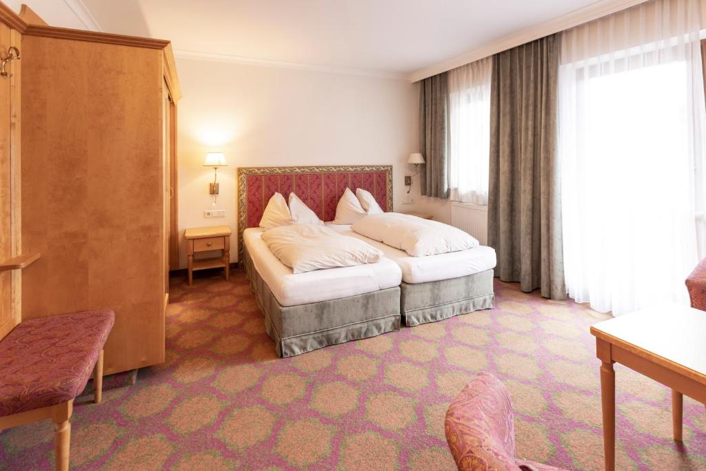 Postel nebo postele na pokoji v ubytování Heart Hotel Nordstern
