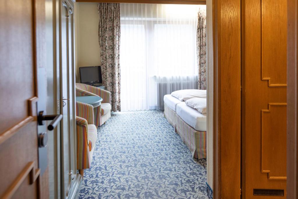 Postel nebo postele na pokoji v ubytování Heart Hotel Nordstern